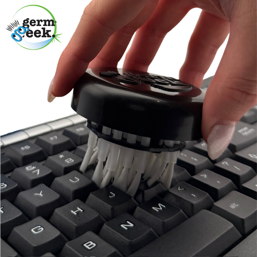 Close-up of Germ Geek keyboard cleaning kit with brushes and cloths for thorough keyboard cleaning.